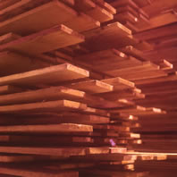 Redwood boards of various length.